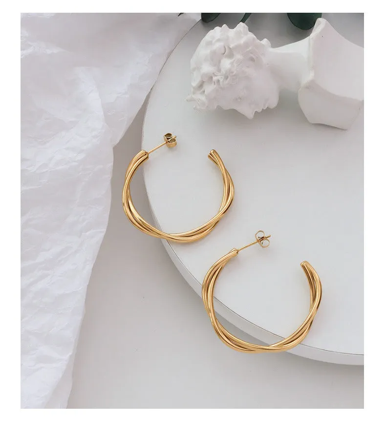 Golden Twist Cross Earrings with Titanium Finish - Unique Genie Collection Piece